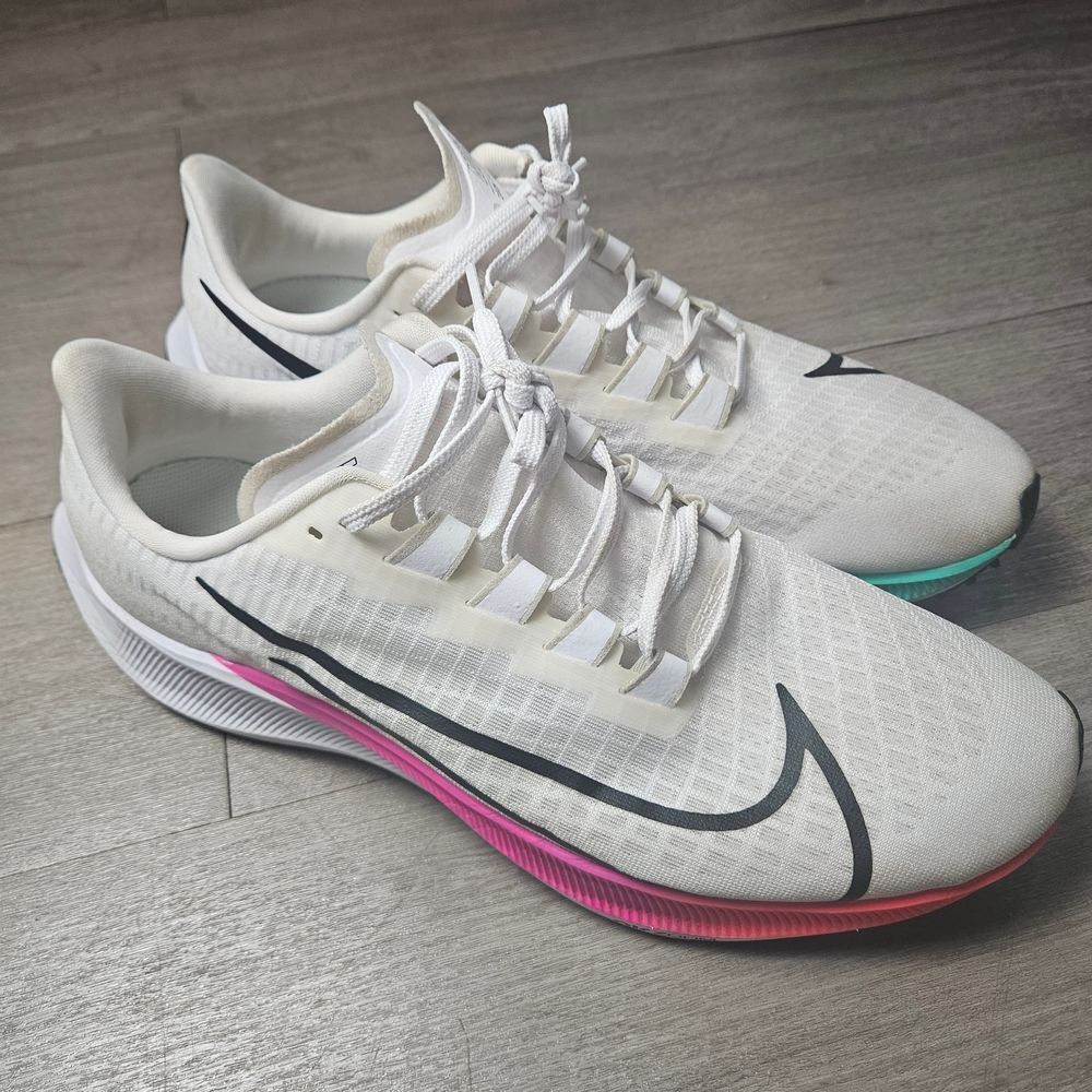 Men’s size 13 (US) - Nike White Running Shoes with Pink and Blue Accents